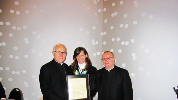 Mayor Zimmer (center) presents a proclamation to Bishop Thomas A Donato (left) along with Msgr. Robert S. Meyer (right))
