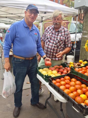 New Jersey Secretary of Agriculture, Douglas Fisher (left) with Lou from Circle Brook Farm. Photo courtesy of the Hoboken Farmers' Market. 